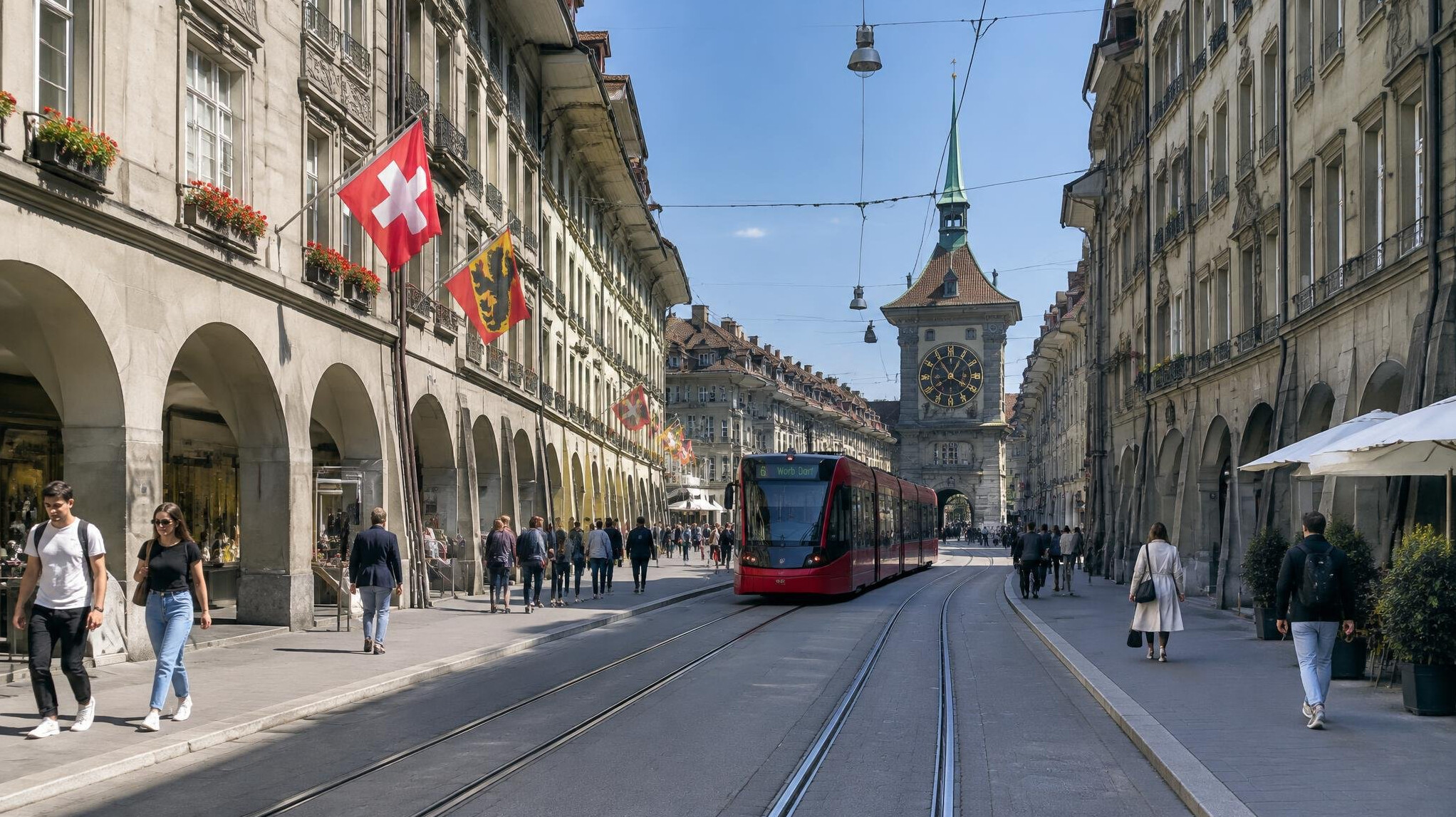 Street view of a Swiss city with tram tracks and old buildings